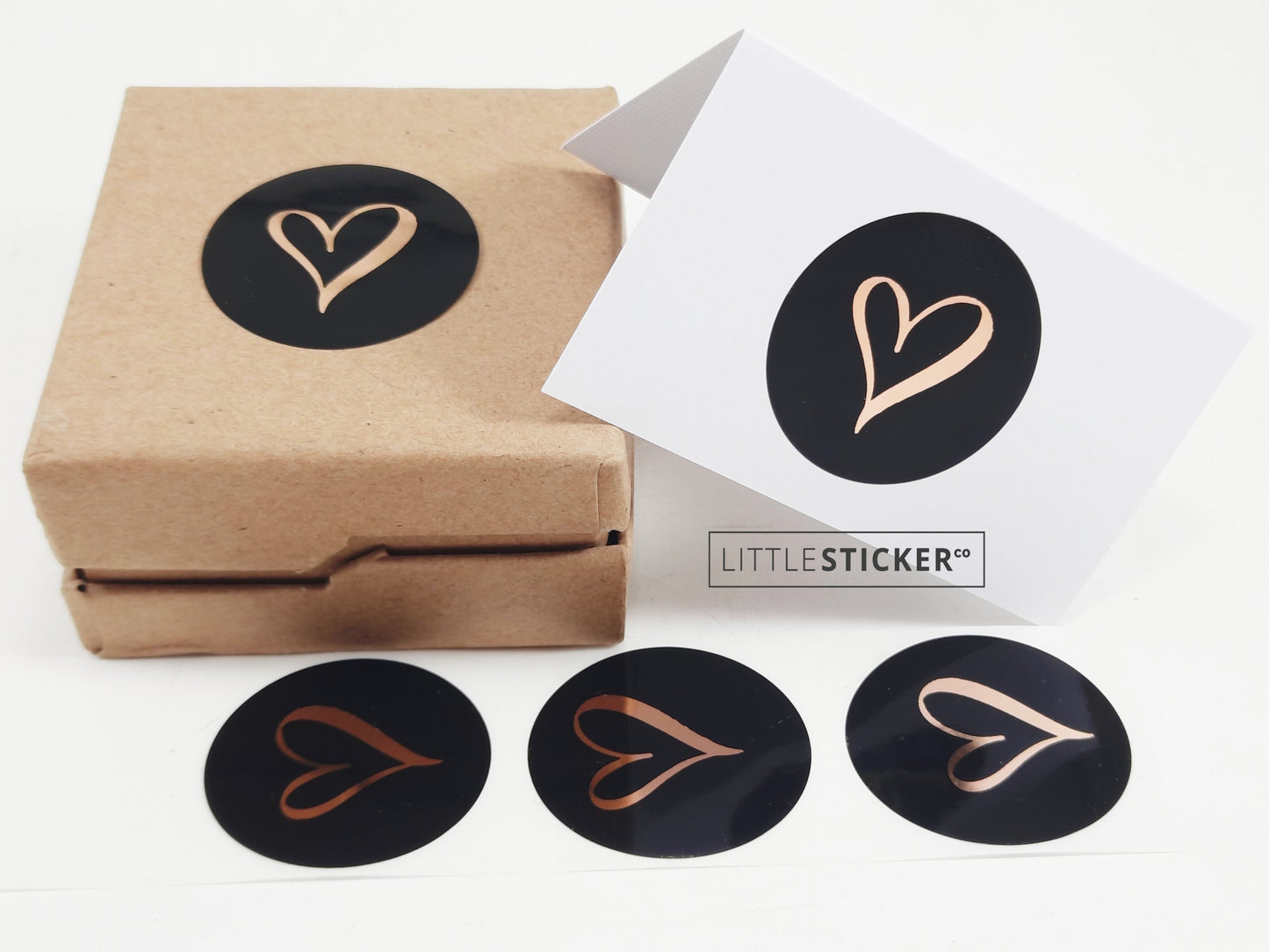Heart stickers hand-drawn love heart. Round gloss black stickers with rose-gold foil. Choice of small, medium or large heart
