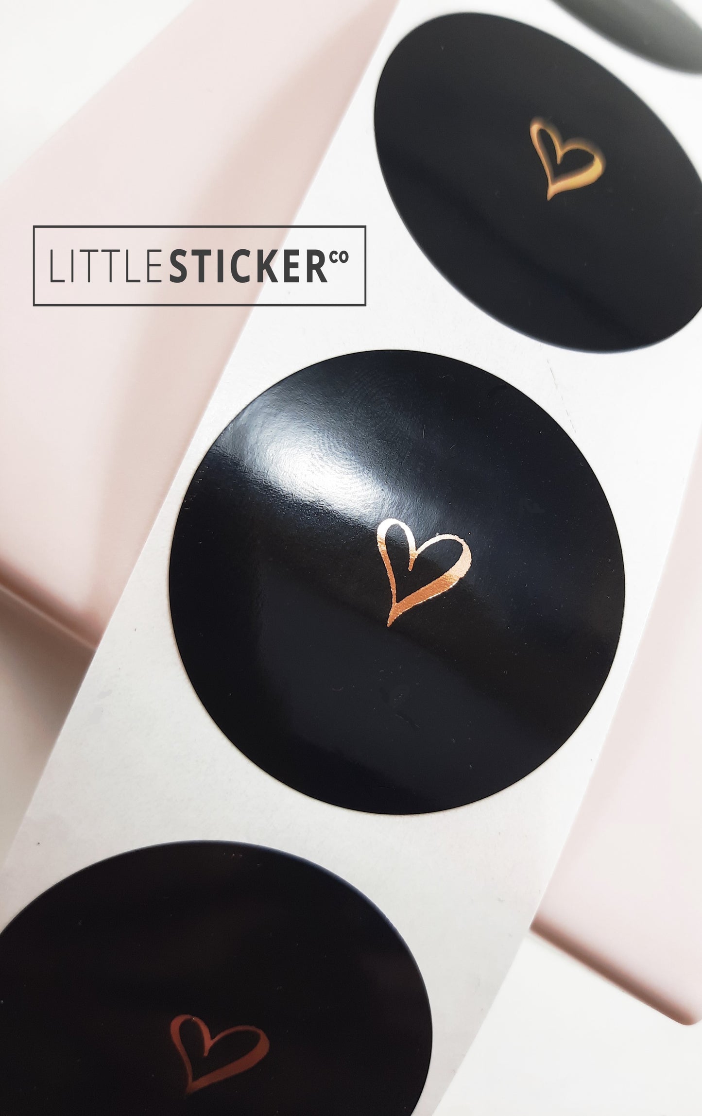 Heart stickers hand-drawn love heart. Round gloss black stickers with rose-gold foil. Choice of small, medium or large heart