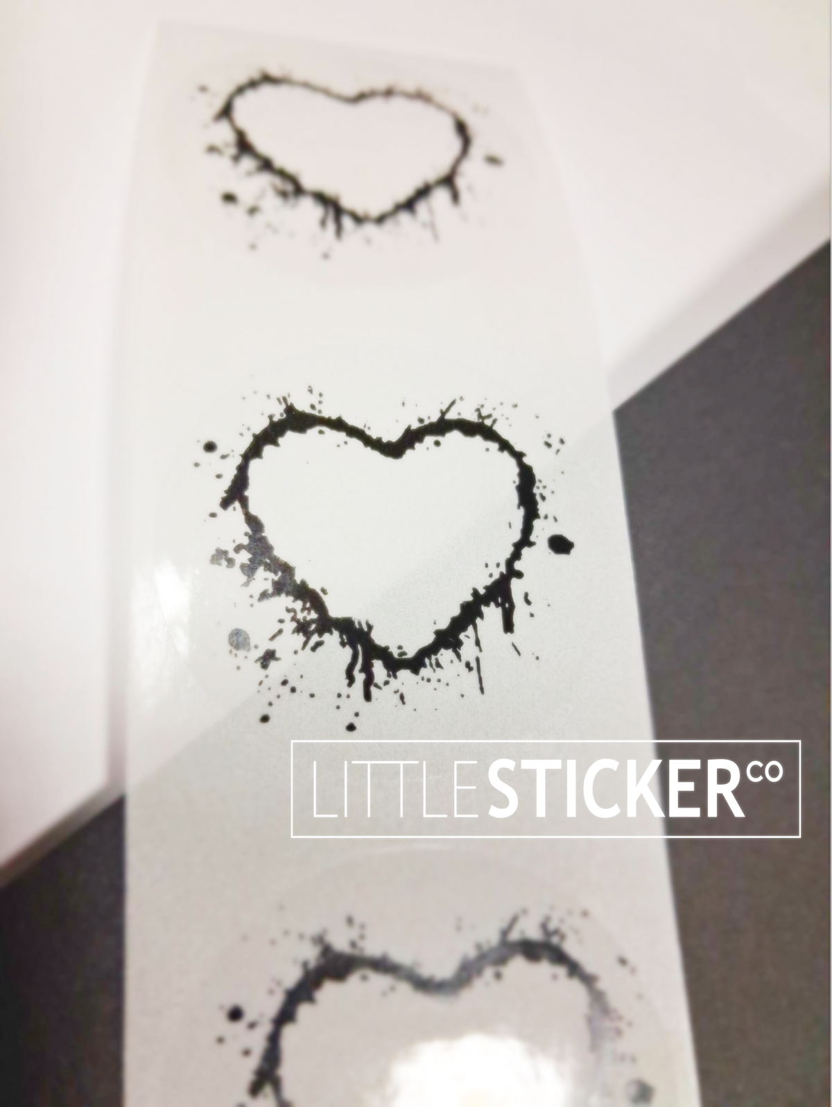 Little Sticker Co's Incredible Monthly Offer: Order before Tuesday 3rd February to get this offer! Round clear stickers with black heart design, custom printed with your text. Sticker size = 40mm (4cm), choose quantity below