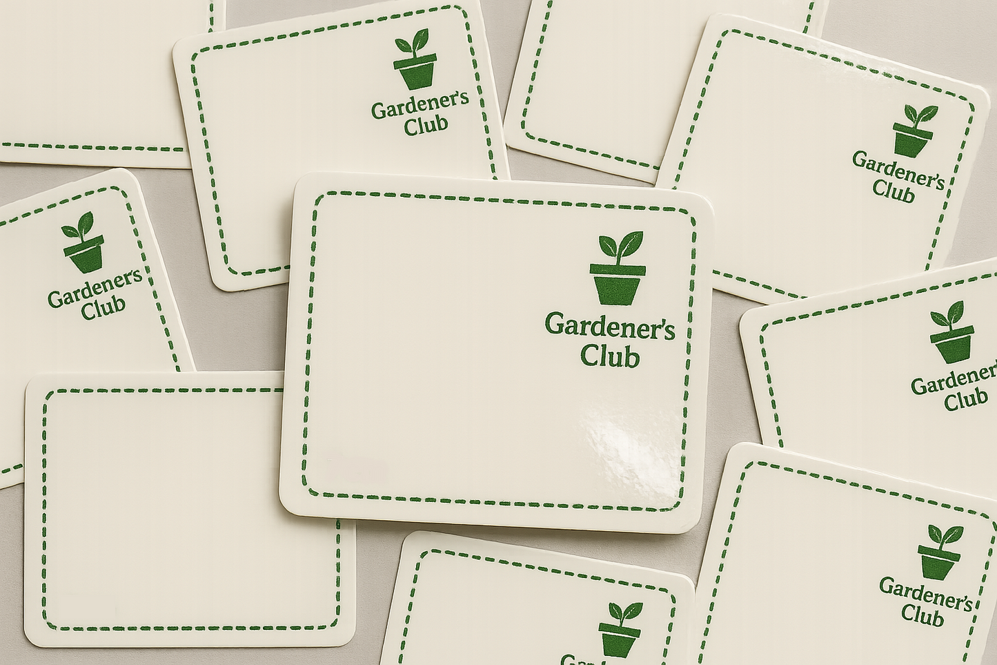 Multiple stickers with 'Gardener's Club' logo in green on a white background