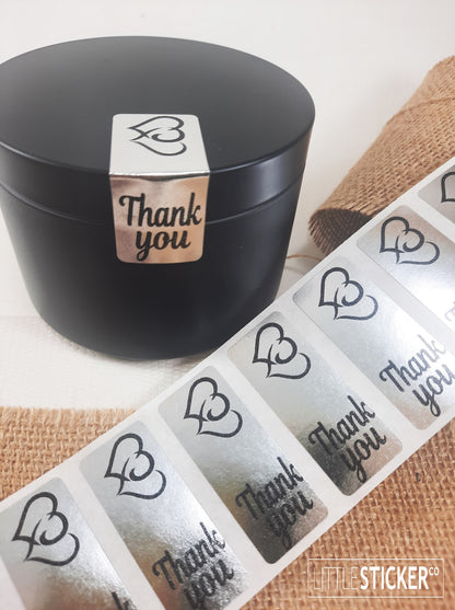 Thank you stickers. 50x20mm rectangle Silver stickers with black ''Thank you'' and twin hearts