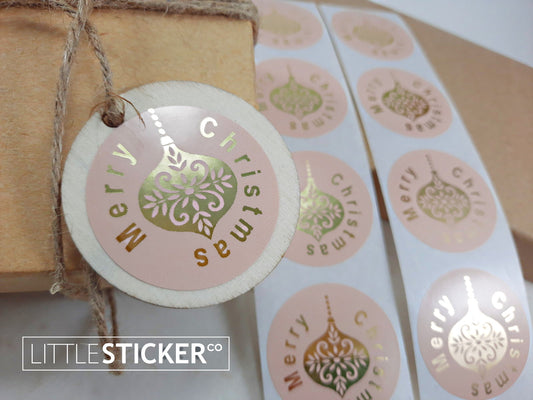 Merry Christmas stickers. 40mm round pink buff gloss stickers with Gold Foil ''Merry Christmas'' and Christmas bauble.