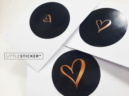 Heart stickers  hand-drawn love heart. Round gloss black stickers with rose-gold foil. Choice of small, medium or large heart
