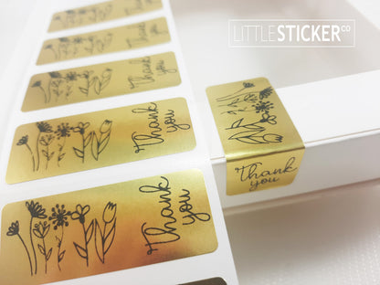 Thank you stickers. 50x20mm rectangle Gold stickers with black ''Thank you'' and sweet hand drawn style flowers