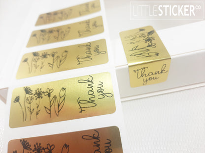 Thank you stickers. 50x20mm rectangle Gold stickers with black ''Thank you'' and sweet hand drawn style flowers