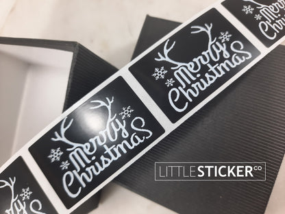 Merry Christmas stickers. Black gloss stickers with white reindeer antlers 50x30mm