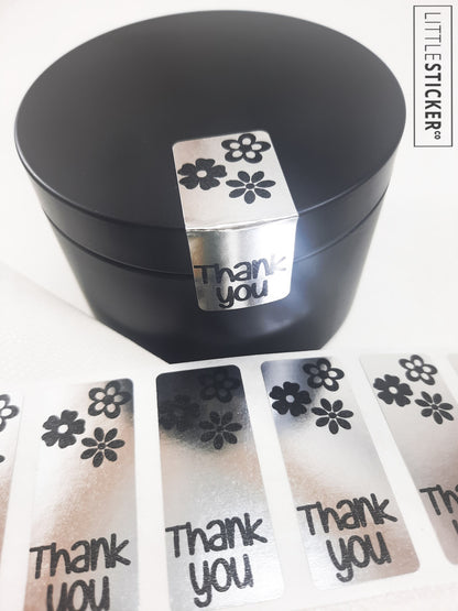 Thank you stickers. 50x20mm rectangle Silver stickers with black ''Thank you'' and cute daisy flowers