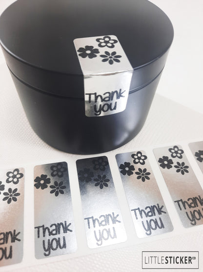 Thank you stickers. 50x20mm rectangle Silver stickers with black ''Thank you'' and cute daisy flowers