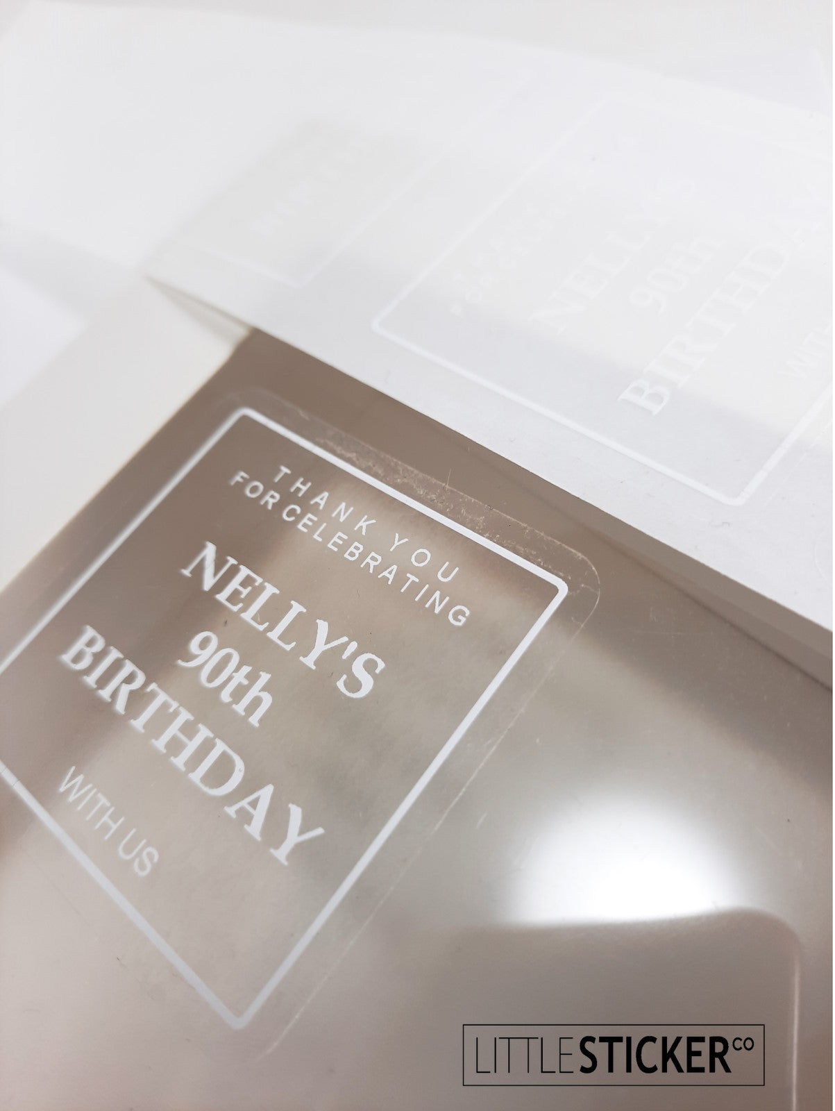 Minimalist and Chic design, clear stickers with white print, 50mm square. Personalised with your text.