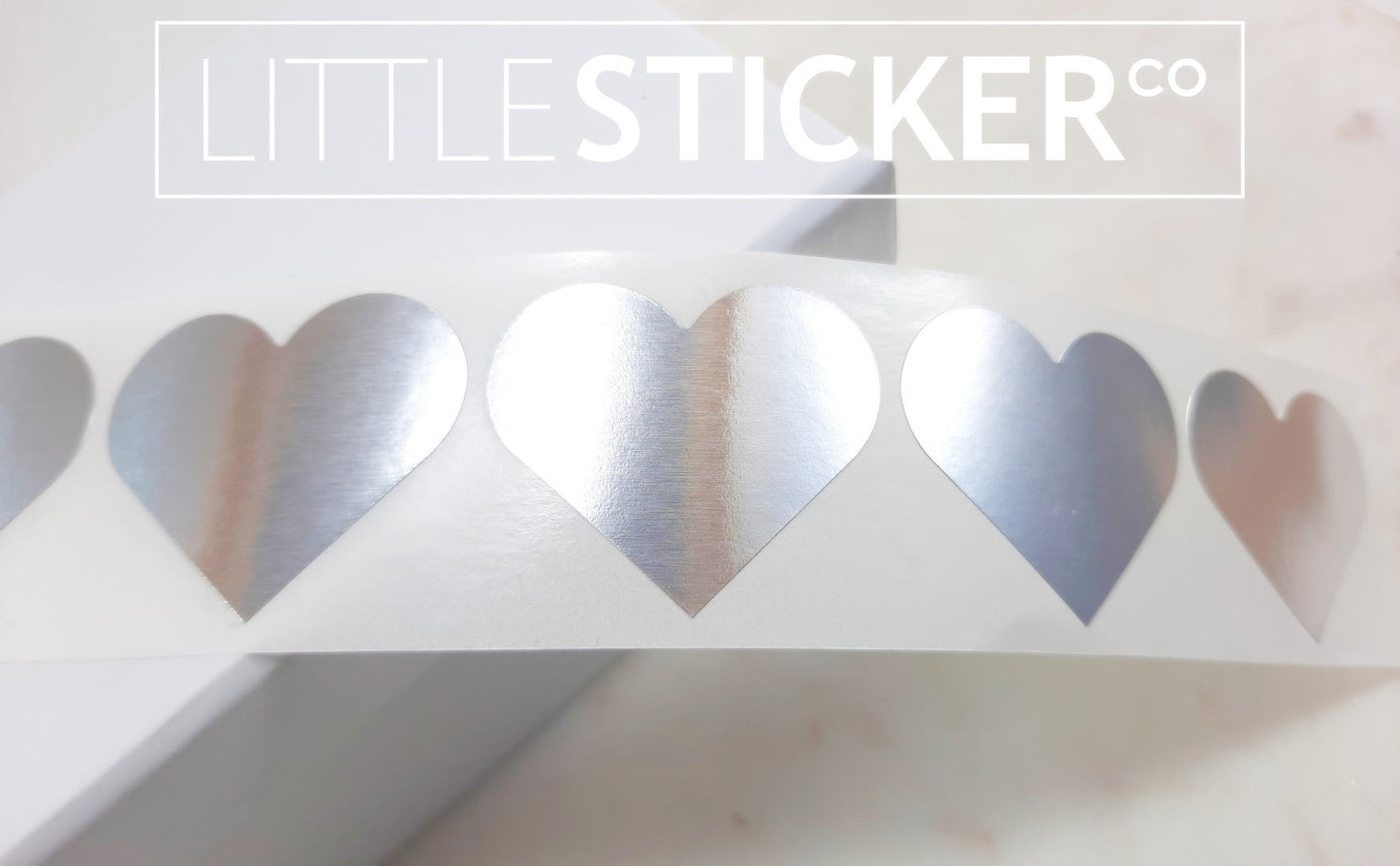 Silver Heart stickers 35x30mm. Metallic silver heart shaped labels