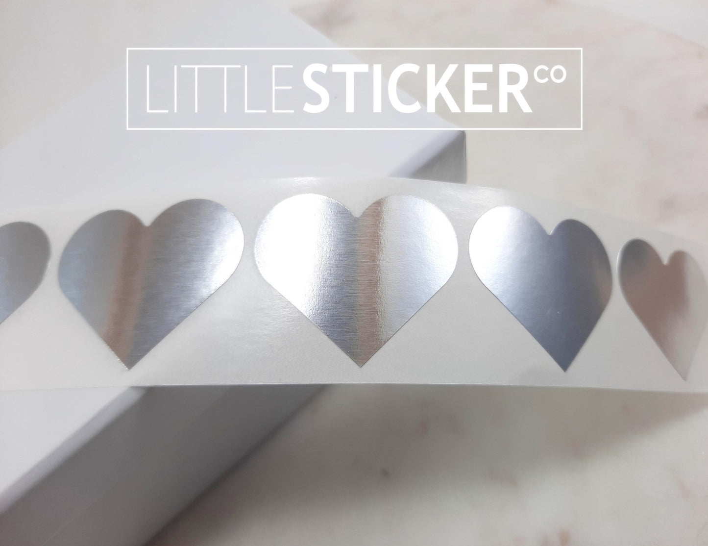 Silver Heart stickers 35x30mm. Metallic silver heart shaped labels