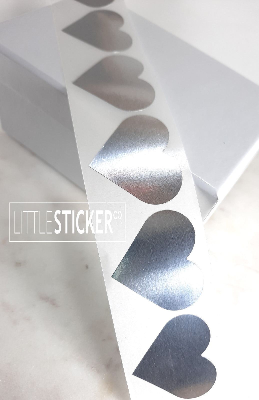 Silver Heart stickers 35x30mm. Metallic silver heart shaped labels