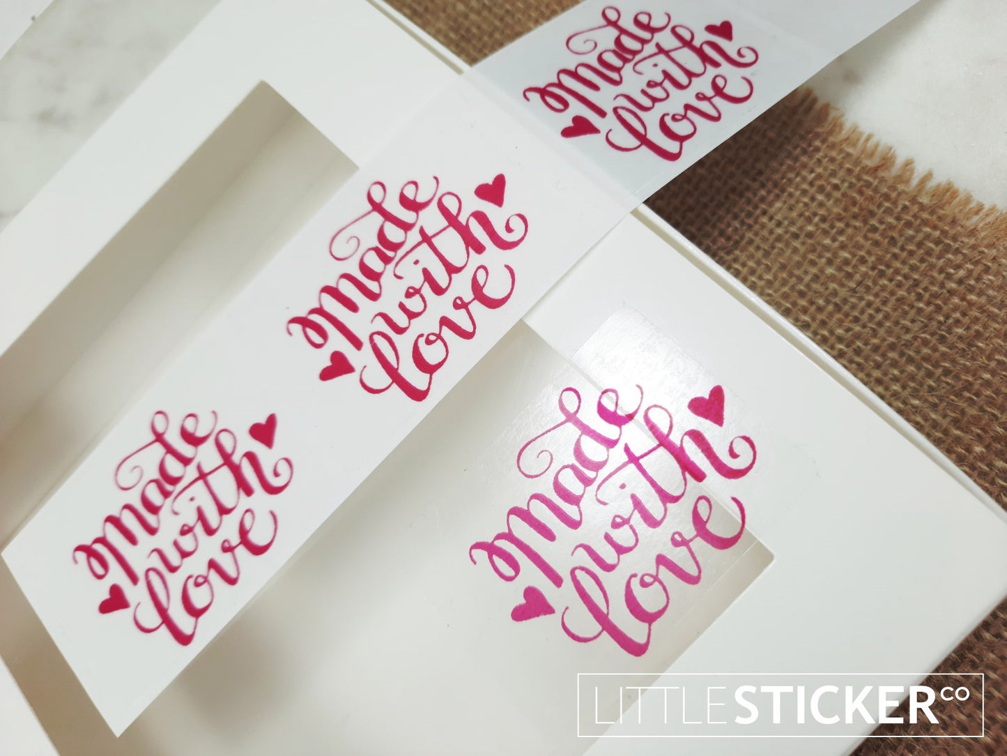 Made with Love stickers. 50x35mm rectangle clear stickers with magenta ''Made with Love'' with cute hearts