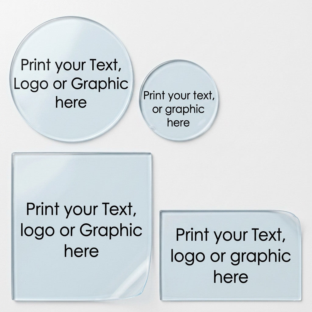 Custom printed transparent labels in three shapes: a large circle, a small circle, one square, one rectangular sticker with one having a curled bottom corner. The labels feature text reading 'Print your Text, logo or graphic here' in black on a transparent surface, set against a clean white background.