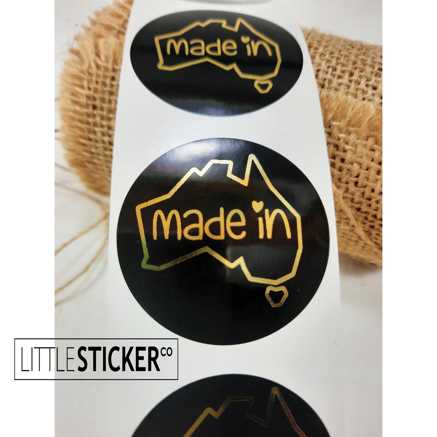 Made in Australia stickers. 40mm round gloss black with Foil gold design and text