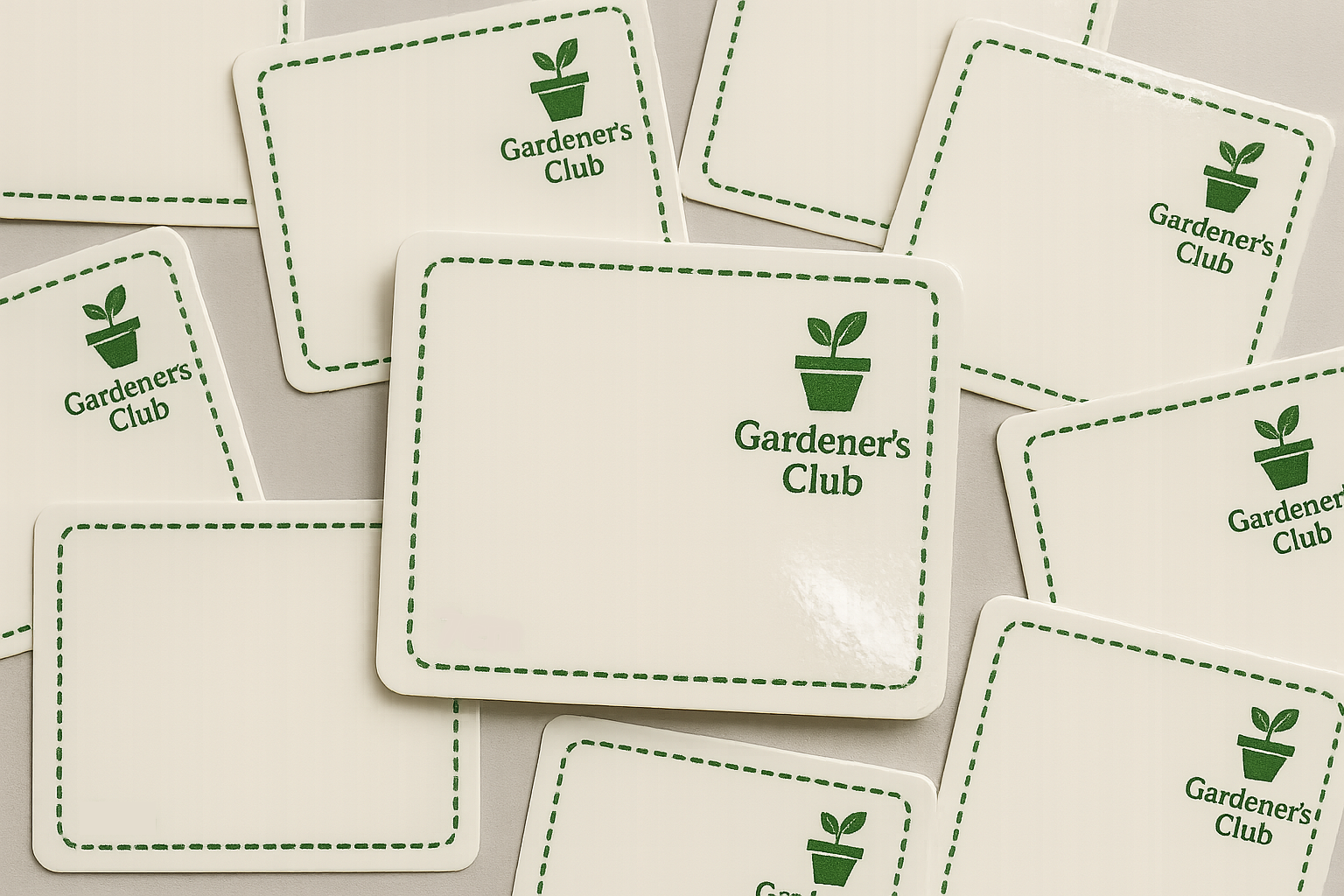 Multiple stickers with 'Gardener's Club' logo in green on a white background